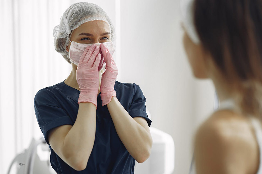 A woman happy because of the results of cosmetic surgery.