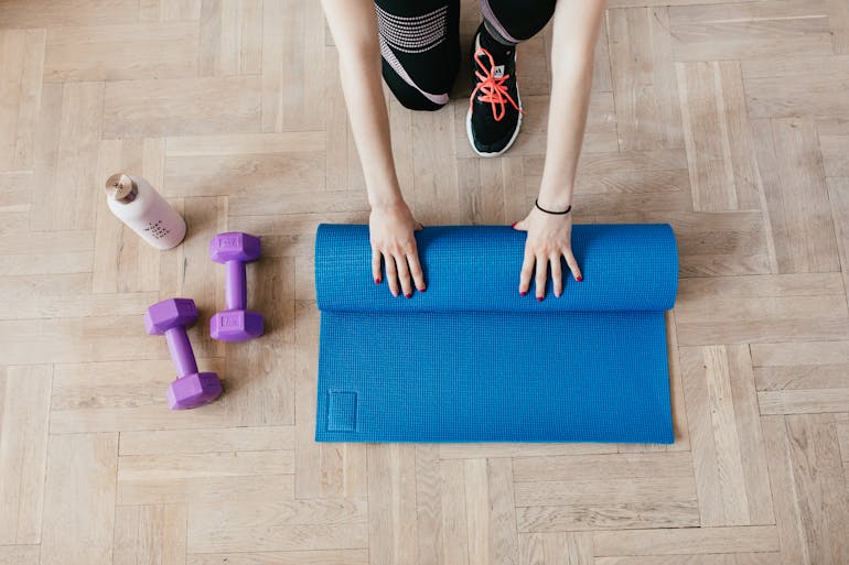 A woman preparing for a home workout