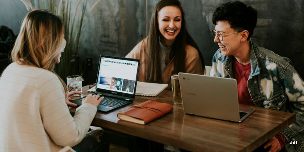 A group of people are smiling and spending time together.